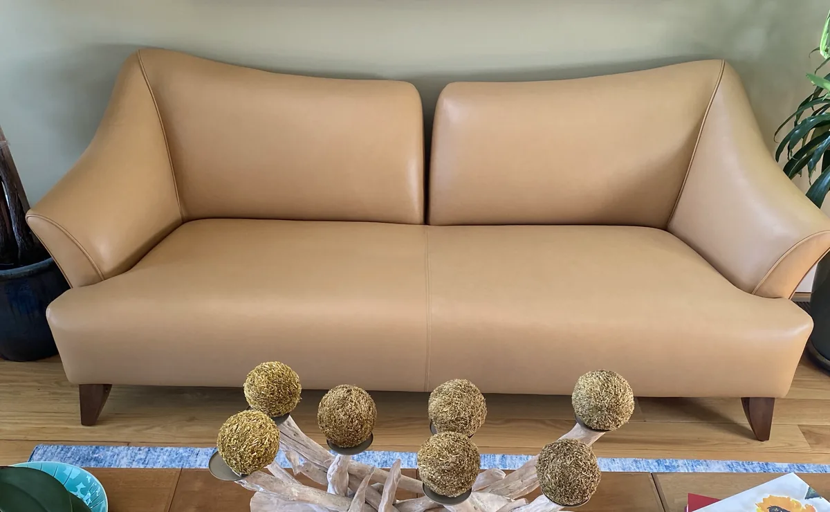 Modern sofa reupholstered in camel leather