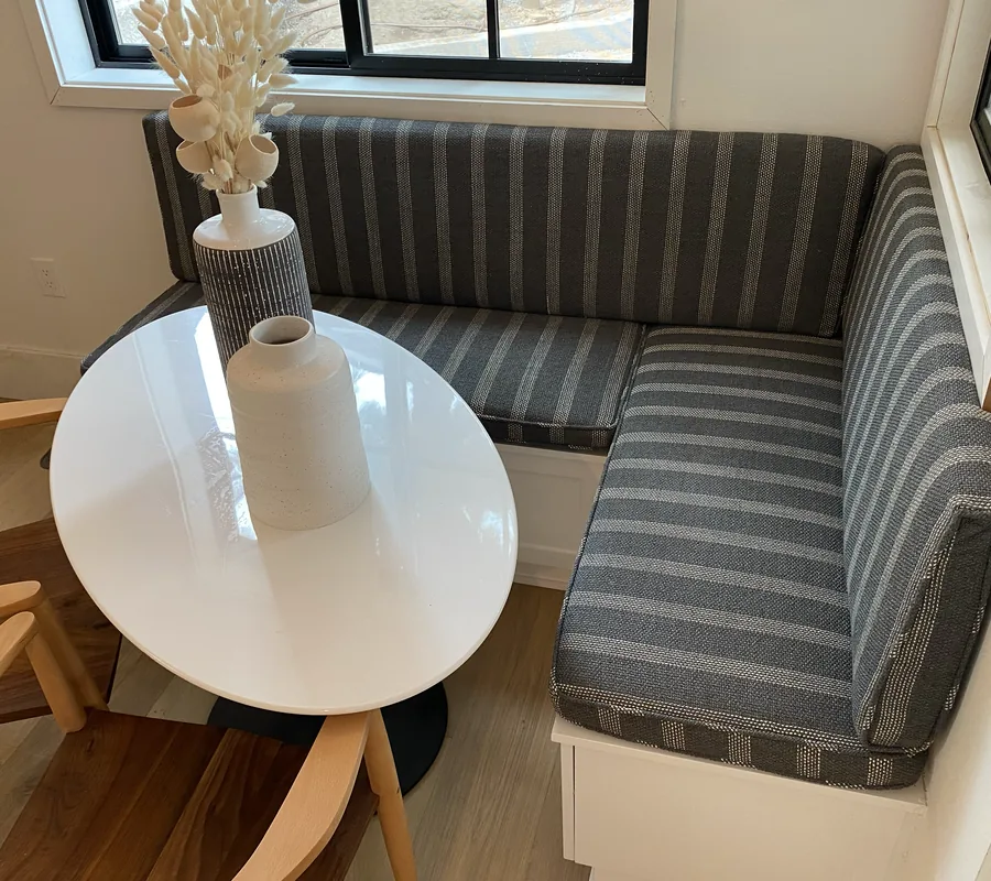 Restaurant dining banquette upholstered in a grey stripe