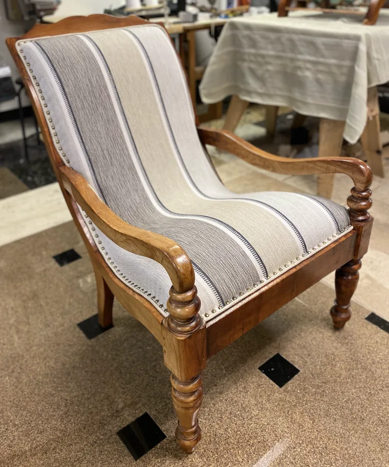 Antique armchair recovered in stripe with nailhead trim