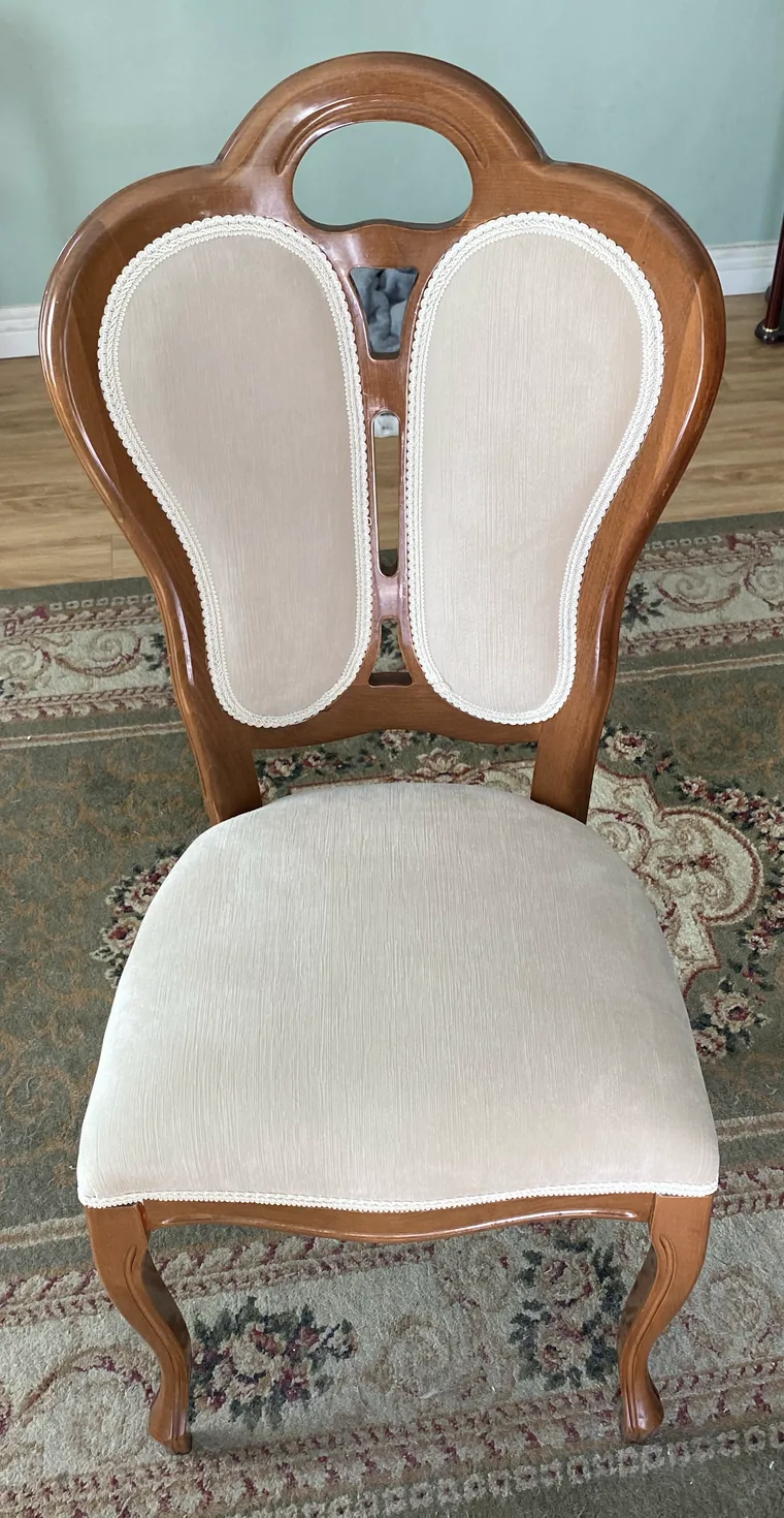 Antique dining chair with a cream velvet seat