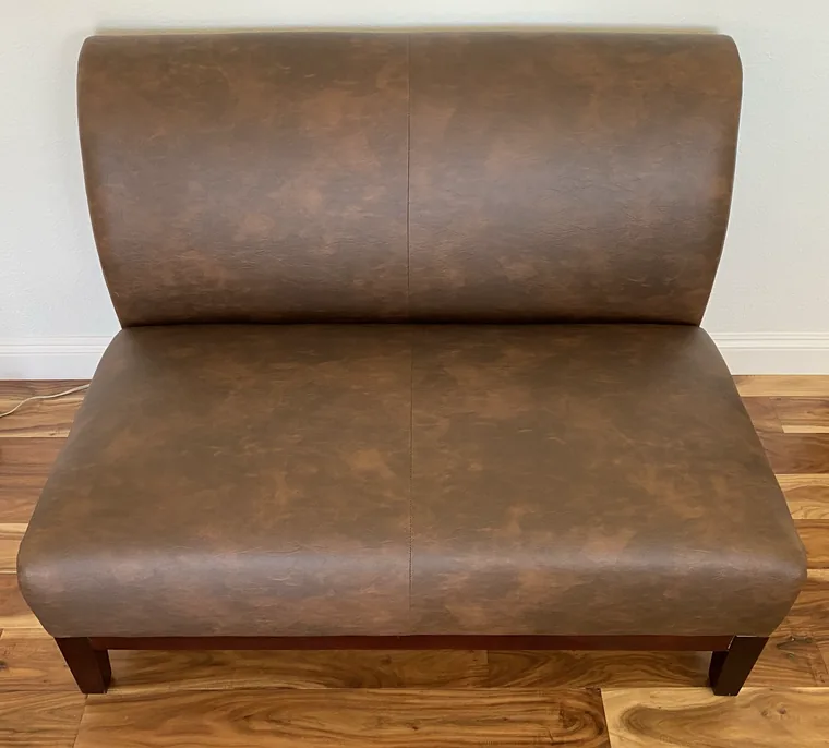 Banquette bench in distressed brown leather