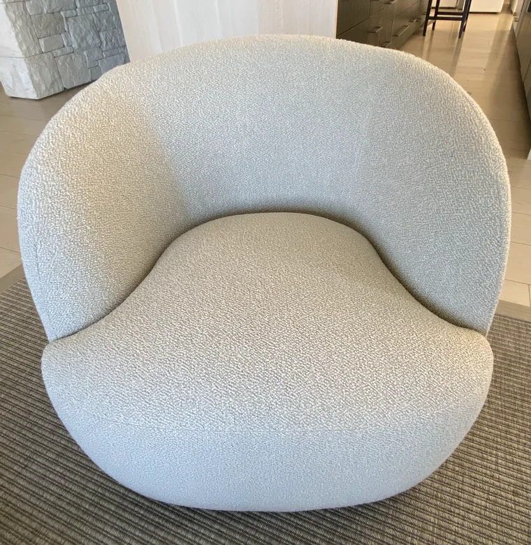 Curved barrel lounge chair in cream boucle