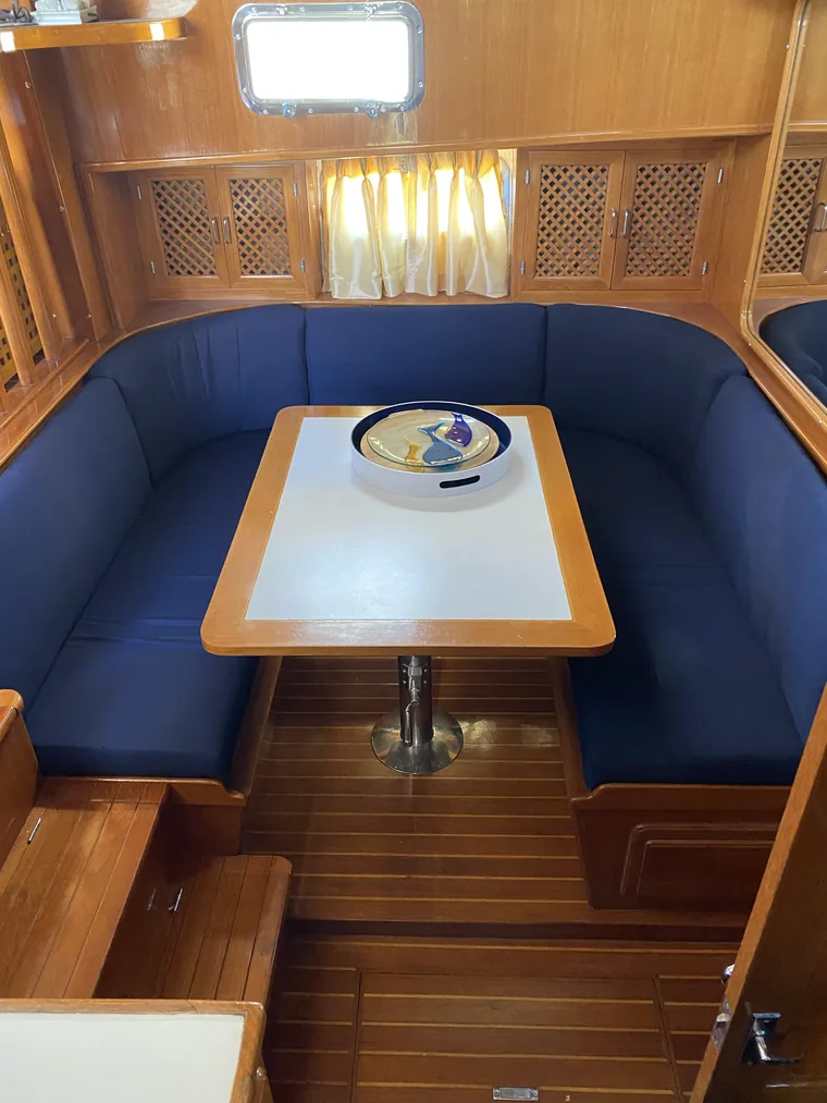 Boat dinette rebuilt with blue marine-grade upholstery