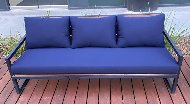 Deck sofa rebuilt with marine-blue outdoor cushions