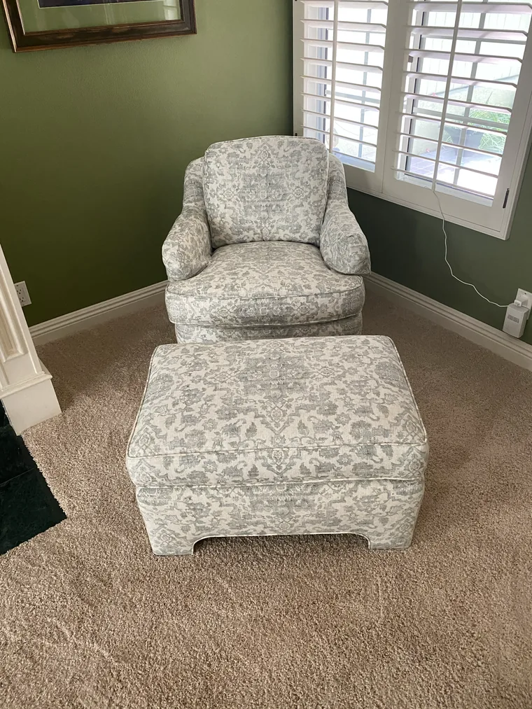 Armchair and ottoman recovered in a floral print