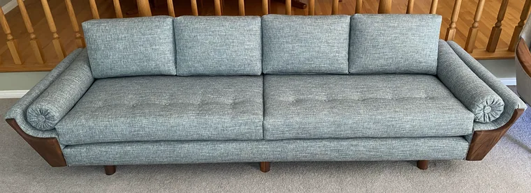 Mid-century sofa recovered in pale blue tufted fabric
