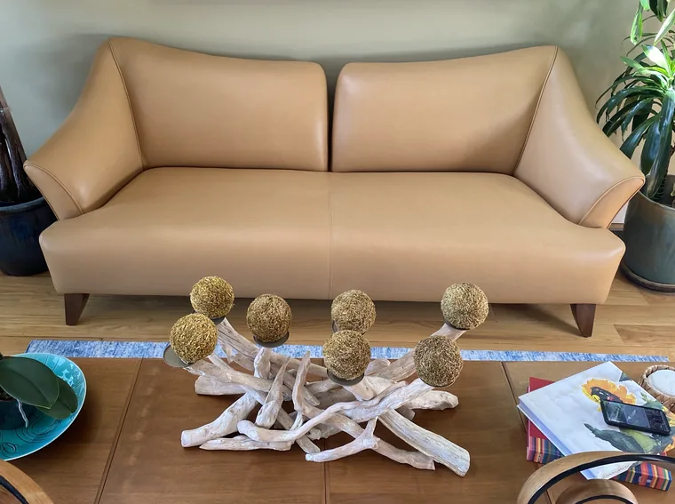 Modern sofa reupholstered in camel leather