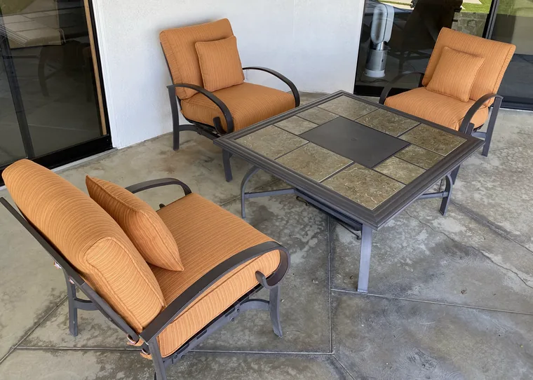 Patio lounge set with new orange outdoor cushions