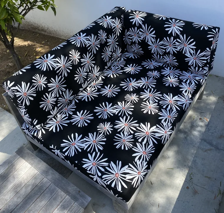 Outdoor daybed cushion in a black and white print