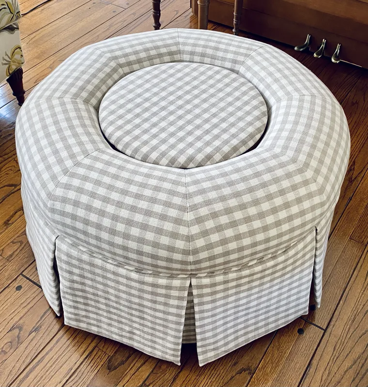 Round skirted ottoman in a gingham check