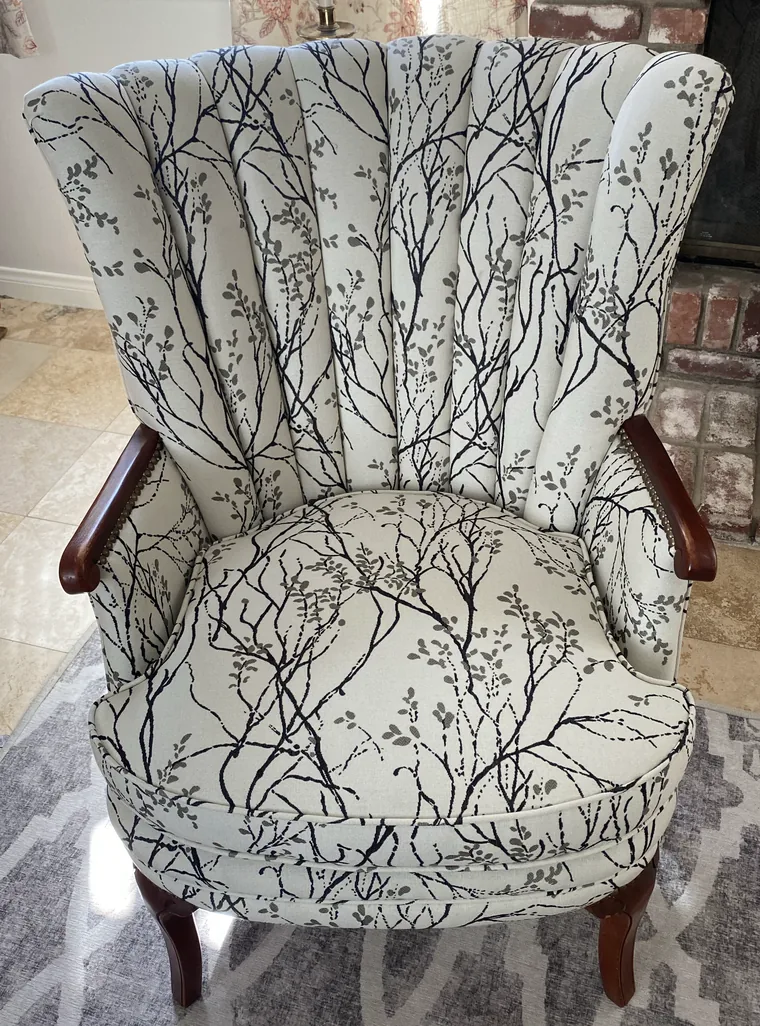 Channel-back wing chair in a botanical branch print